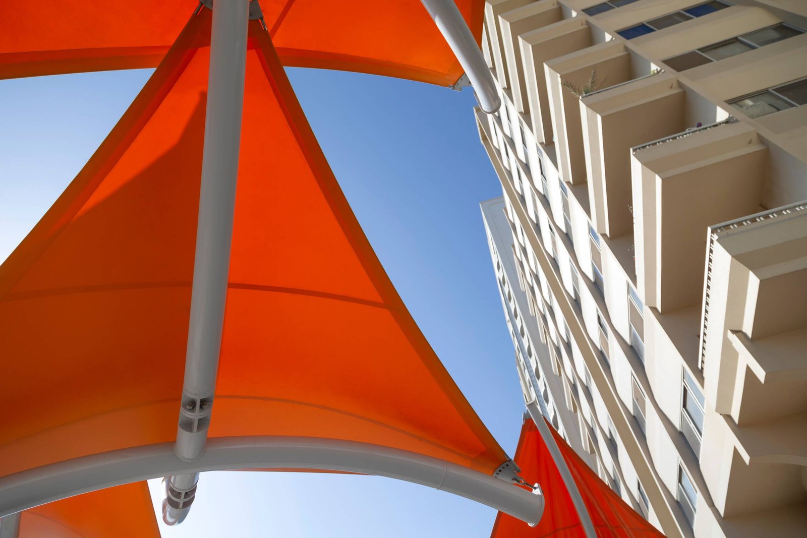 colorful-orange-sun-shade-against-blue-sky-in-abu-2026-03-19-23-05-59-utc